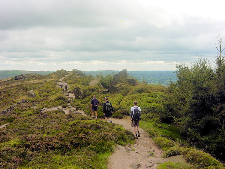 Walkers in a line on the Roaches ridge path