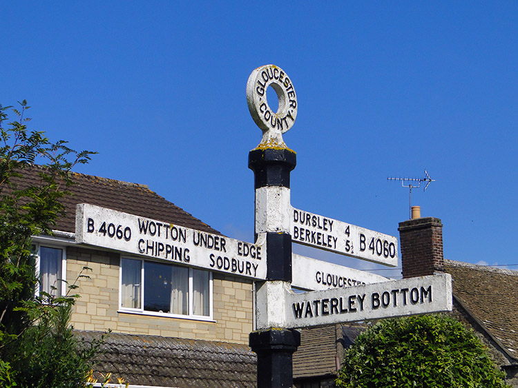Signpost to quirky named places in North Nibley