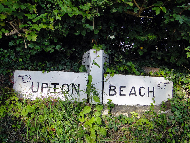 Fingerpost sign near Beach