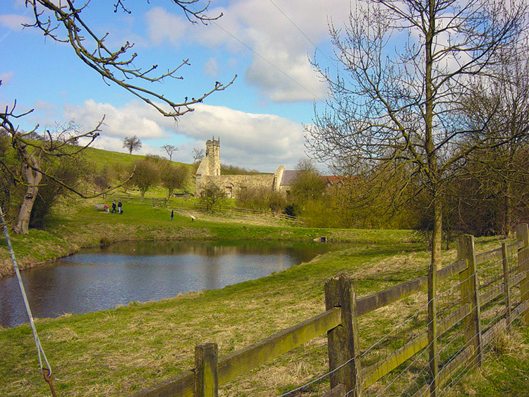 Wharram Percy mill pond and church