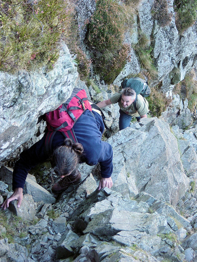 Deke and Spud climb up the narrow groove