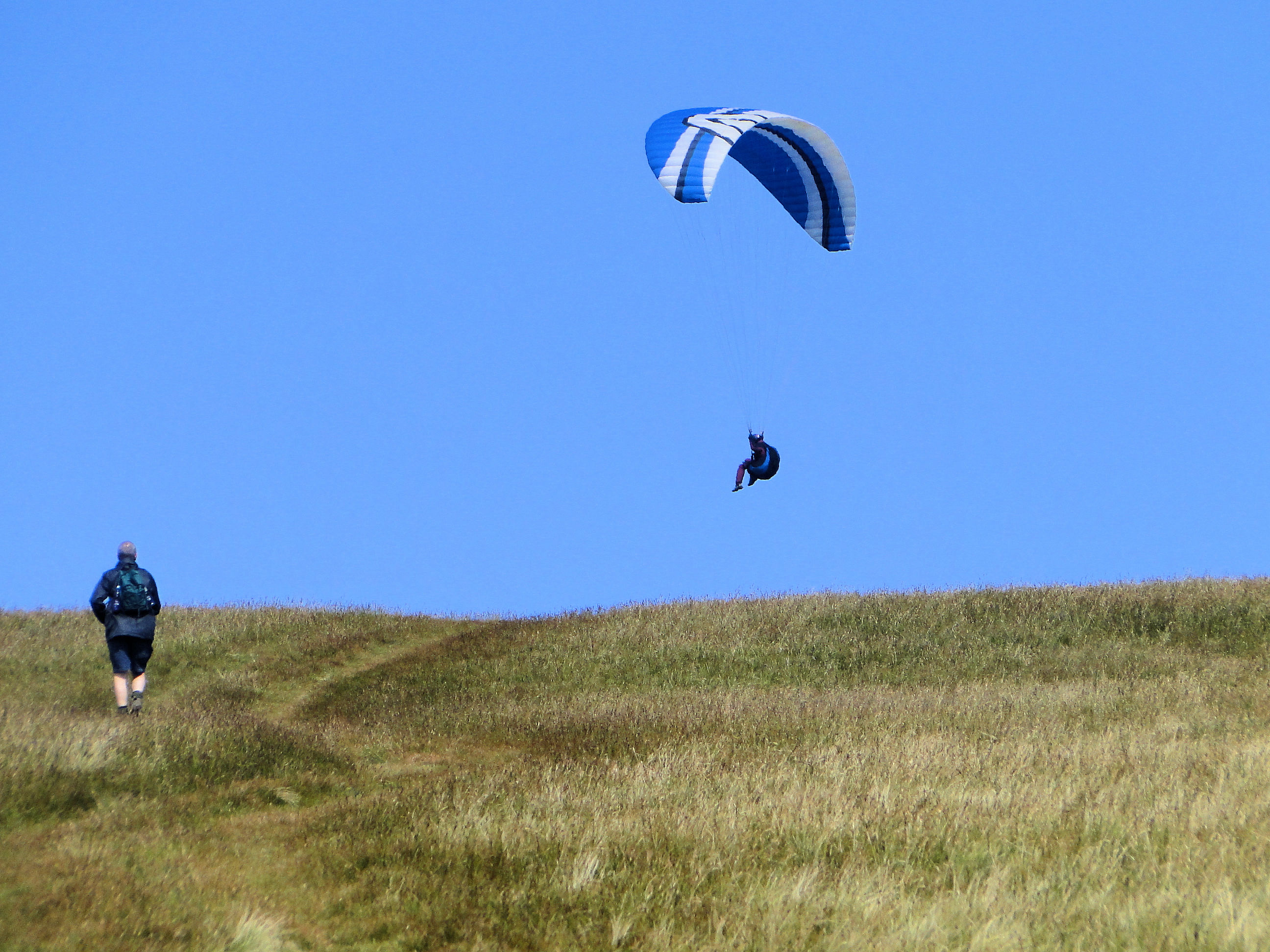 Steve observes a paraglider on Clough Head