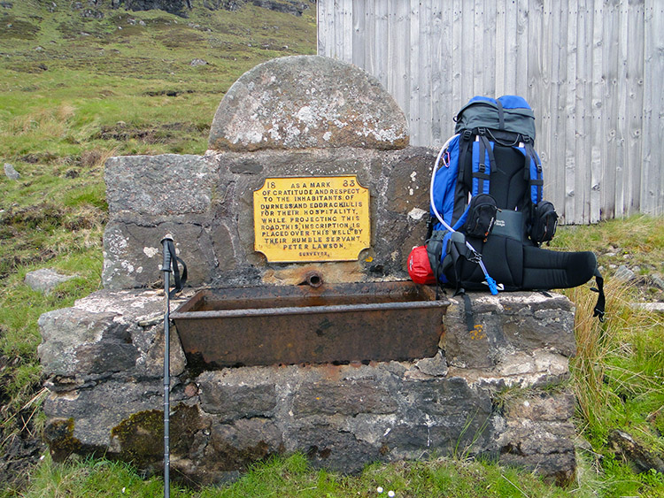 Memorial to road builder Peter Lawson beside the A838