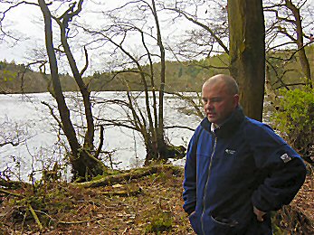 Joe rests by a secluded pond