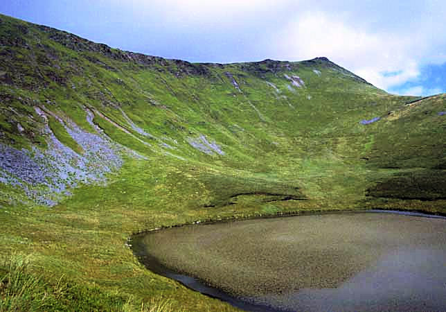 The summit is Cadair Berwyn with Llyn Lluncaws lake in the foreground