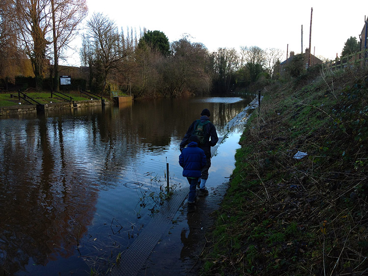 Wading through the riverside path at Milby Cut